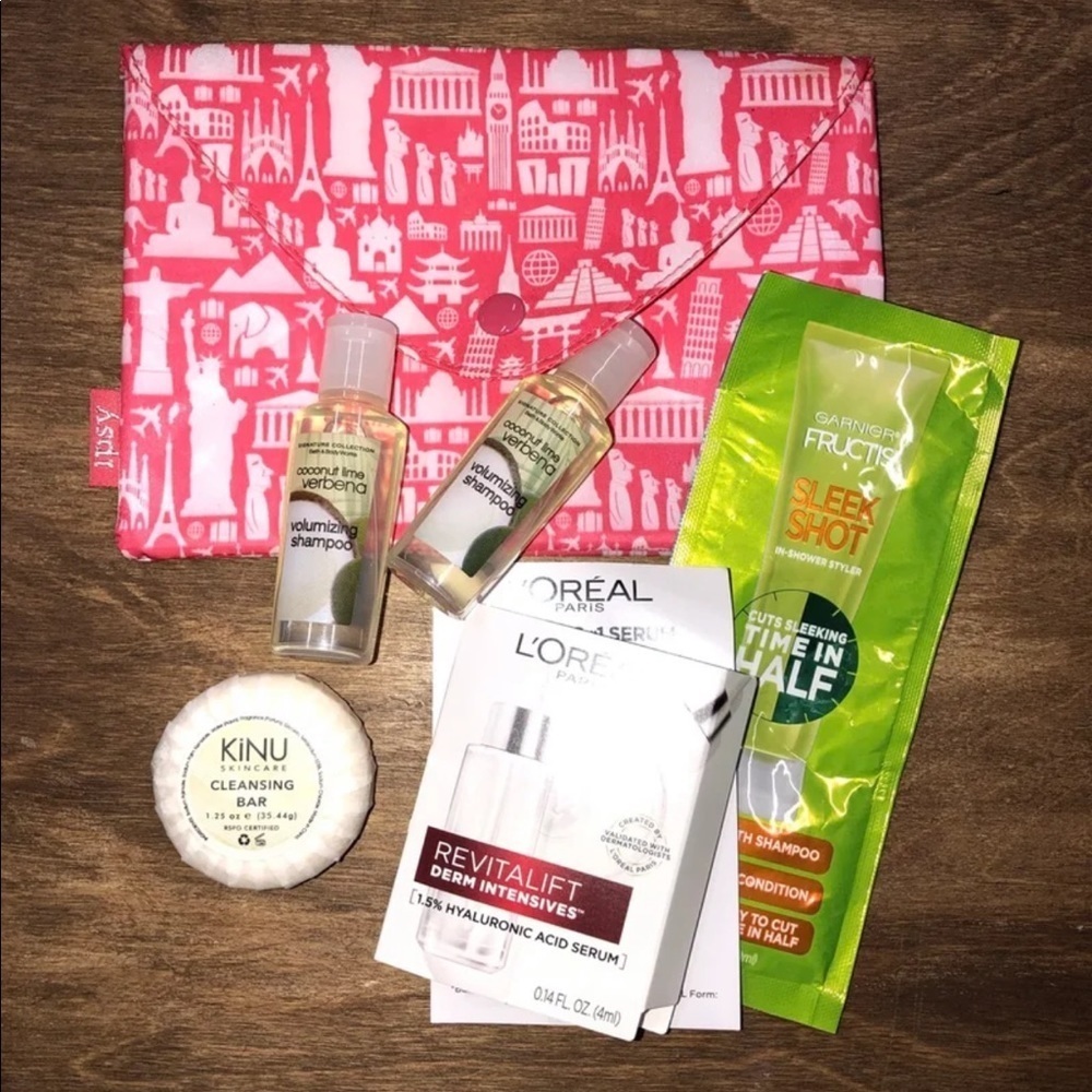 Ipsy pink travel bag with toiletries